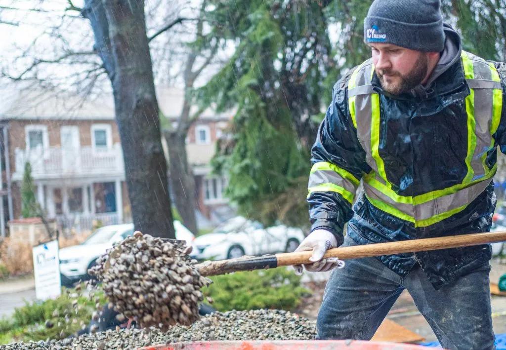 underpinning contractor digging for basement stabilization