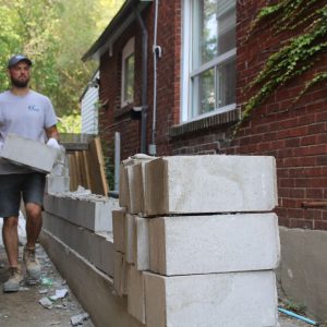 pouring new concrete base downward